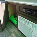 Viking 9.0TD Cabinet with Air Conditioner, Radio and Storage (with door open) May Show Optional Features. Features and Options Subject to Change Without Notice.