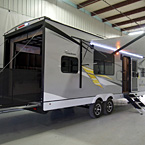 Adrenaline 27KB Exterior Rear 3/4 View Showing Optional Ramp Door Party Patio Kit May Show Optional Features. Features and Options Subject to Change Without Notice.