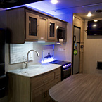 Adrenaline 27KB Interior Showing Kitchen Area with LED Backsplash May Show Optional Features. Features and Options Subject to Change Without Notice.