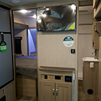 Adrenline 21LT Interior Showing LED RV Mounted Above Entertainment Center May Show Optional Features. Features and Options Subject to Change Without Notice.