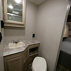 Foot flush toilet, storage, sink and mirrored medicine cabinet May Show Optional Features. Features and Options Subject to Change Without Notice.