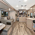 The 261BHS is the perfect mid-size bunkhouse floor plan! From back to front there is a full size super slide with a booth dinette and jiffy sofa, both with additional storage underneath, door side kitchen, and an entertainment center separating the living space from the bedroom. (Biscotti Décor Shown, TV Not included) May Show Optional Features. Features and Options Subject to Change Without Notice.