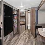 The 261BHS features extra wide double over double bunks which offer sleeping for the kids and/
or adults, and our floor to ceiling
shelved pantry really enhances the storage space to round out all your kitchen supply needs. (Biscotti Décor Shown) May Show Optional Features. Features and Options Subject to Change Without Notice.