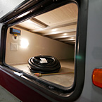 Door Side Pass Through Storage with Solar Hook Up
 May Show Optional Features. Features and Options Subject to Change Without Notice.