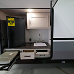 Camp Kitchen with Coleman Stove Top Extended and two Drawers Open May Show Optional Features. Features and Options Subject to Change Without Notice.
