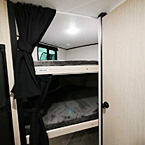Double Over Double Bunks with Curtains  May Show Optional Features. Features and Options Subject to Change Without Notice.