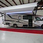 Camp Side with Awning Extended and LED Light Strip, Warehouse Storage Compartments Open
 May Show Optional Features. Features and Options Subject to Change Without Notice.