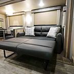 Tri-Fold Sofa Shown in Open Position, Next to Booth Dinette
 May Show Optional Features. Features and Options Subject to Change Without Notice.