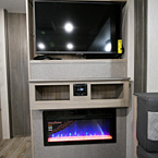 Entertainment Center with T.V., Two Storage Compartments, AM/FM Radio, Fireplace Below
 May Show Optional Features. Features and Options Subject to Change Without Notice.