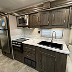 View of Kitchen,  All Stainless Steel appliances, High Rise Kitchen Faucet, Tile Backsplash
 May Show Optional Features. Features and Options Subject to Change Without Notice.