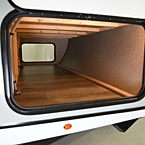 Door Side with Lighted Pass Through Storage
 May Show Optional Features. Features and Options Subject to Change Without Notice.