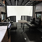 Interior View of the Ramp Door Party Patio Shown Open and Roll Over Sofa Shown Open
 May Show Optional Features. Features and Options Subject to Change Without Notice.