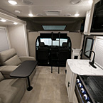 Back to Front - Kitchen, Lounge Seats, Overhead Bunk with Ladder, Driver and Passenger Seat
 May Show Optional Features. Features and Options Subject to Change Without Notice.