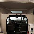 Front of Unit with Bunk, Television, Driver Seat and Built in Phone Charger
 May Show Optional Features. Features and Options Subject to Change Without Notice.