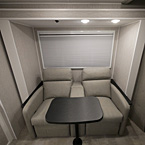 Lounge Seats with Table Shown Open and Two Overhead Lights
 May Show Optional Features. Features and Options Subject to Change Without Notice.