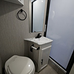 Foot Flush Toilet Next to Sink with Mirror Above Faucet
 May Show Optional Features. Features and Options Subject to Change Without Notice.