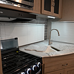 Stovetop and Sink with Covers Shown Open
 May Show Optional Features. Features and Options Subject to Change Without Notice.