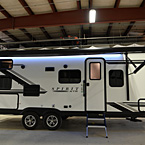 Door Side with Exterior Lights On and Awning Extended
 May Show Optional Features. Features and Options Subject to Change Without Notice.
