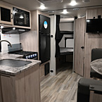 Front to Back - Dinette, Kitchen, Bathroom Shown Closed, Part of Bunks
 May Show Optional Features. Features and Options Subject to Change Without Notice.