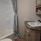 Bathroom - Shower, Foot Flush Toilet, Sink, and Mirrored Medicine Cabinet
 May Show Optional Features. Features and Options Subject to Change Without Notice.