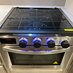 Three- Burner Cook Top with Glass Top and Stove. Blue LED Lights on Knobs.
 May Show Optional Features. Features and Options Subject to Change Without Notice.