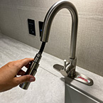 Stainless Steel Pull Down Faucet Shown Extended.
 May Show Optional Features. Features and Options Subject to Change Without Notice.