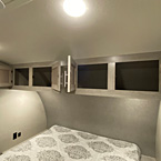 Four Cabinets Above Bed Shown Open.
 May Show Optional Features. Features and Options Subject to Change Without Notice.