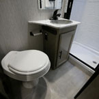 Toilet Next to Single Bowl Vanity.
 May Show Optional Features. Features and Options Subject to Change Without Notice.
