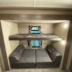 30 Inch by 74 Inch Flip Up Bunk with Cube Futon Below. 
 May Show Optional Features. Features and Options Subject to Change Without Notice.