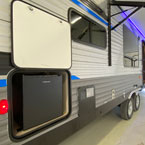 Door Side with Optional Solid Steps Shown Extended. Awning LED Light Shown on in Blue.
 May Show Optional Features. Features and Options Subject to Change Without Notice.