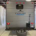 Rear of the 303QBCK- Cargo Rack Extended with Spare Tire Mounted to Rack, Outside Shower.
 May Show Optional Features. Features and Options Subject to Change Without Notice.