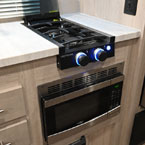 Two Burner Cook Top with Glass Cover Shown Open. Microwave Below Cook Top.
 May Show Optional Features. Features and Options Subject to Change Without Notice.