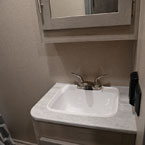 Part of Mirrored Medicine Cabinet Shown with Single Bowl Vanity Below.
 May Show Optional Features. Features and Options Subject to Change Without Notice.