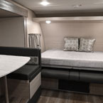 Part of Dinette Shown. Murphy Bed Shown in the Open Position with Two Decorative Pillows.
 May Show Optional Features. Features and Options Subject to Change Without Notice.