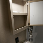 Medicine Cabinet Shown Open with Two Shelves.
 May Show Optional Features. Features and Options Subject to Change Without Notice.