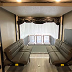Ramp Door Shown Open with Ramp Patio Kit. Sofa On Either Side Shown, Happijac Bed System Shown Overhead.
 May Show Optional Features. Features and Options Subject to Change Without Notice.