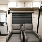 Two Thomas Payne Swivel Recliners with Four Cabinet Doors Overhead, Next to Entry Door.
 May Show Optional Features. Features and Options Subject to Change Without Notice.