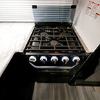 Three Burner Cook Top with Glass Cover Shown Open.
 May Show Optional Features. Features and Options Subject to Change Without Notice.