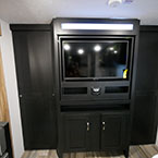 Entertainment Center with Swivel TV Shown in Living Area with Two Privacy Doors On Either Side of Entertainment Shown Closed.
 May Show Optional Features. Features and Options Subject to Change Without Notice.