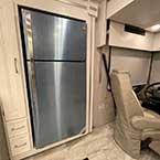 Stainless Steel Residential Refrigerator and pantry and partial view of swivel cockpit chair May Show Optional Features. Features and Options Subject to Change Without Notice.