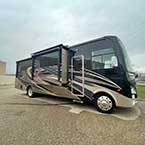 Exterior full door side view of Coachmen Mirada 315KS with slide out May Show Optional Features. Features and Options Subject to Change Without Notice.