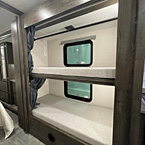 Double bunk beds and wardrobe in hallway with rod for hanging clothes, extra outlets and tv hook up on each bunk
 May Show Optional Features. Features and Options Subject to Change Without Notice.