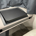 View of collapsible and expandable desk for passenger seat
 May Show Optional Features. Features and Options Subject to Change Without Notice.