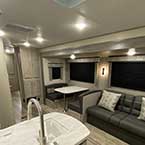 Interior view of Coachmen Catalina living space from rear to front
 May Show Optional Features. Features and Options Subject to Change Without Notice.