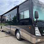 Exterior view of the Coachmen Sportscoach 376ES door side with slide out
 May Show Optional Features. Features and Options Subject to Change Without Notice.