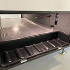 Pass through storage with panel doors on both sides shown open May Show Optional Features. Features and Options Subject to Change Without Notice.