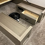 Underbed storage area with storage drawer shown open and bed shown up May Show Optional Features. Features and Options Subject to Change Without Notice.