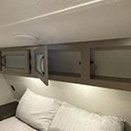 Overhead storage cabinets shown open over bed May Show Optional Features. Features and Options Subject to Change Without Notice.