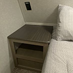 End table with shelving on left side of bed May Show Optional Features. Features and Options Subject to Change Without Notice.