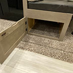 Close-up of under bench storage with easy access cabinet door shown open May Show Optional Features. Features and Options Subject to Change Without Notice.